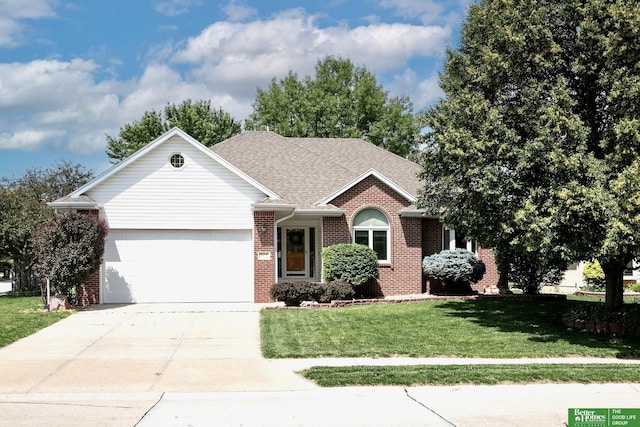 16140 Josephine St, Omaha, NE 68136 - ranch-style home featuring brick siding, an attached garage, a front yard, and concrete driveway