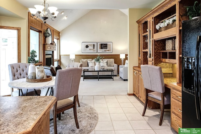 16140 Josephine St, Omaha, NE 68136 - dining room with vaulted ceiling, a chandelier, light tile patterned floors, and light carpet