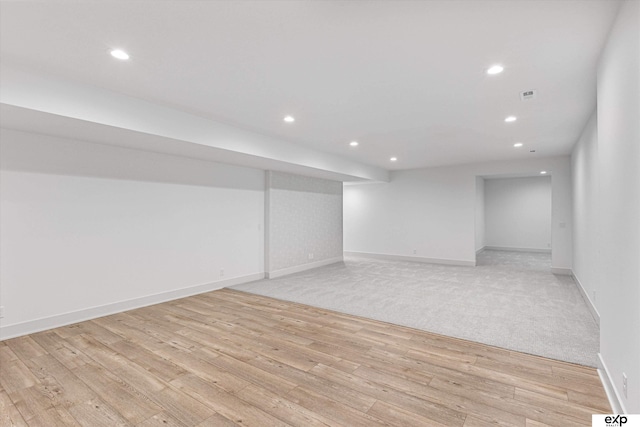 5516 N 208th Ave, Omaha, NE 68022 - finished below grade area with light wood-style floors and recessed lighting