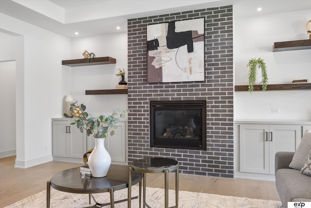 5516 N 208th Ave, Omaha, NE 68022 - living area featuring light wood-style flooring, recessed lighting, and a brick fireplace