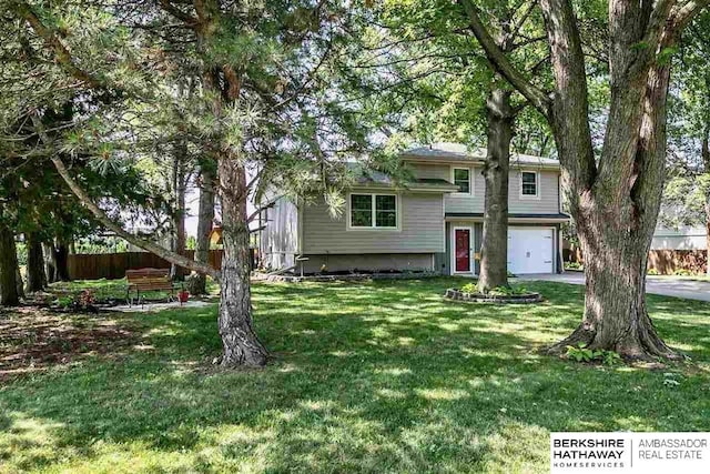 301 Gladys Ave, Yutan, NE 68073 - tri-level home featuring an attached garage and driveway