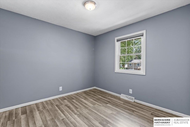 301 Gladys Ave, Yutan, NE 68073 - empty room featuring wood finished floors and baseboards