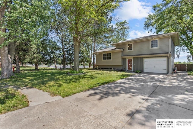 301 Gladys Ave, Yutan, NE 68073 - split level home featuring a garage and driveway