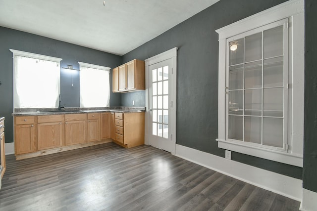 603 E Maple St, Sutton, NE 68979 - kitchen with dark wood-type flooring and dark countertops