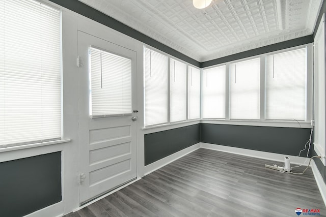 603 E Maple St, Sutton, NE 68979 - unfurnished sunroom featuring healthy amount of natural light