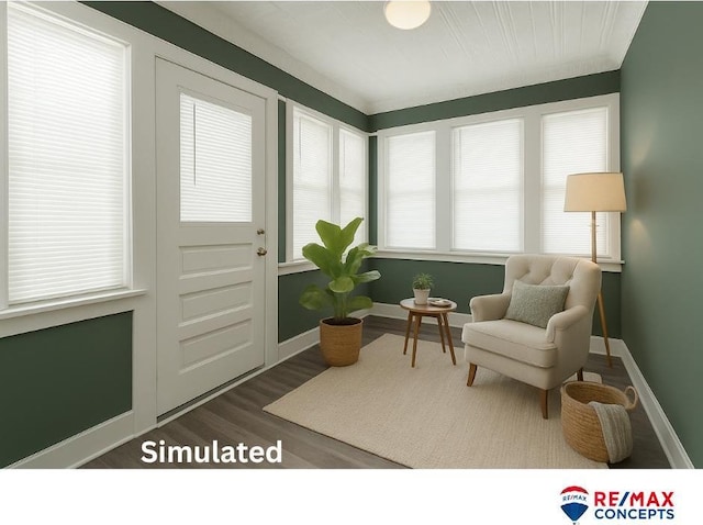 603 E Maple St, Sutton, NE 68979 - living area featuring wood finished floors and baseboards
