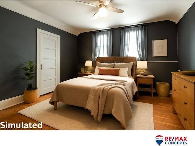 603 E Maple St, Sutton, NE 68979 - bedroom featuring lofted ceiling, light wood finished floors, and a ceiling fan