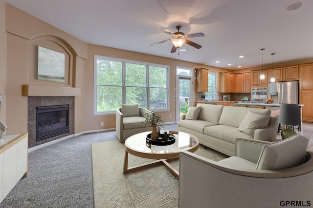 6732 S 169th Ave, Omaha, NE 68135 - living room with a ceiling fan, a tile fireplace, light carpet, and recessed lighting