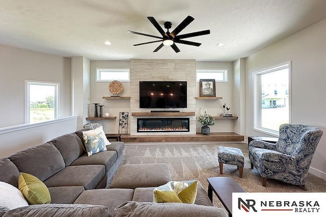 11701 S 119th Ave, Papillion, NE 68046 - living room with a ceiling fan, carpet, a tile fireplace, and recessed lighting