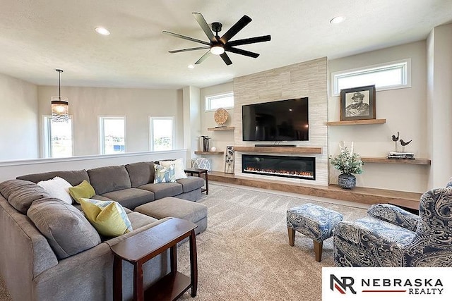 11701 S 119th Ave, Papillion, NE 68046 - carpeted living area with ceiling fan, recessed lighting, plenty of natural light, and a tiled fireplace
