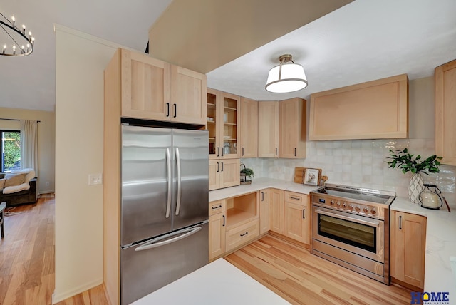 6833 Summerset Ct, Lincoln, NE 68516 - kitchen with appliances with stainless steel finishes, light brown cabinetry, light wood-style flooring, light countertops, and backsplash