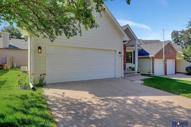 6833 Summerset Ct, Lincoln, NE 68516 - view of front of home featuring a garage, a front yard, concrete driveway, and roof with shingles