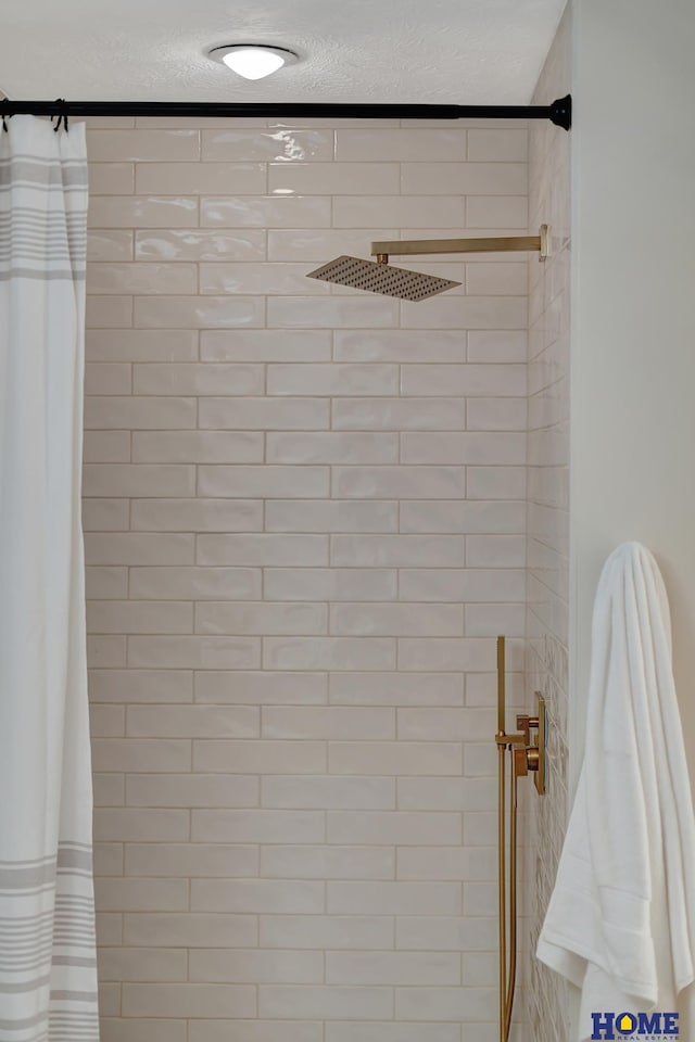 6833 Summerset Ct, Lincoln, NE 68516 - bathroom view of a textured ceiling and tiled shower