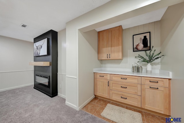 6833 Summerset Ct, Lincoln, NE 68516 - bar with light carpet and a multi sided fireplace