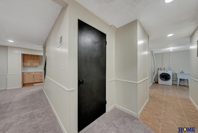 6833 Summerset Ct, Lincoln, NE 68516 - hallway featuring washer / clothes dryer, recessed lighting, and light tile patterned floors