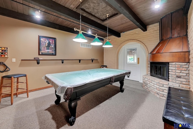 6833 Summerset Ct, Lincoln, NE 68516 - playroom with a wooden ceiling with exposed beams, carpet flooring, arched walkways, billiards, and a brick fireplace