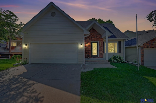 6833 Summerset Ct, Lincoln, NE 68516 - ranch-style home featuring driveway, a yard, a garage, and brick siding