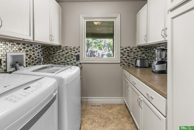 1015 N 127th Cir, Omaha, NE 68154 - laundry room featuring washer and clothes dryer and cabinet space