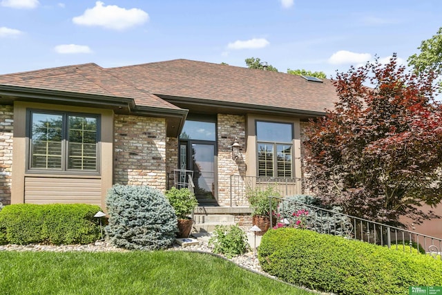 1015 N 127th Cir, Omaha, NE 68154 - view of front of property featuring a shingled roof and brick siding