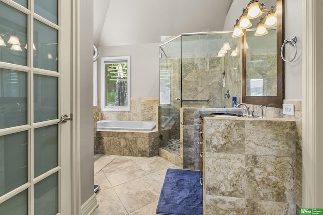 1015 N 127th Cir, Omaha, NE 68154 - bathroom with a shower stall, a bath, vanity, lofted ceiling, and a chandelier