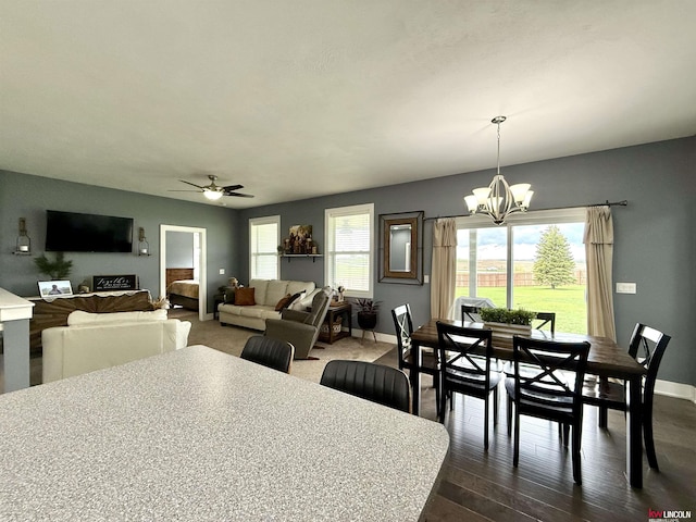 120 Snow Valley Cir, Palmyra, NE 68418 - dining area with a chandelier, a ceiling fan, and dark wood-style flooring