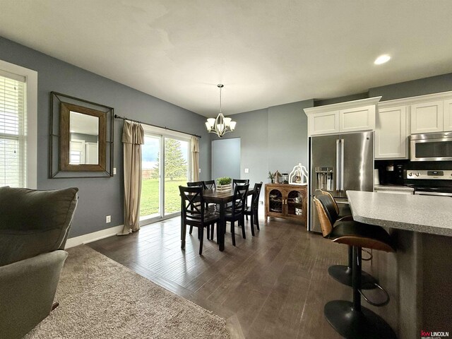 120 Snow Valley Cir, Palmyra, NE 68418 - dining room with a chandelier, dark wood-style flooring, and recessed lighting