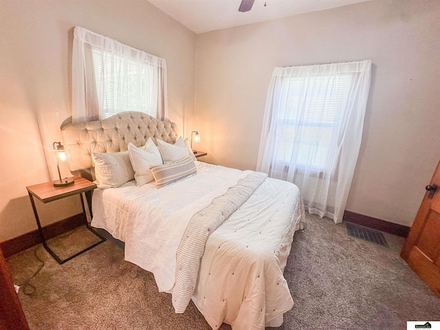 624 A St, Lincoln, NE 68502 - carpeted bedroom with baseboards and ceiling fan