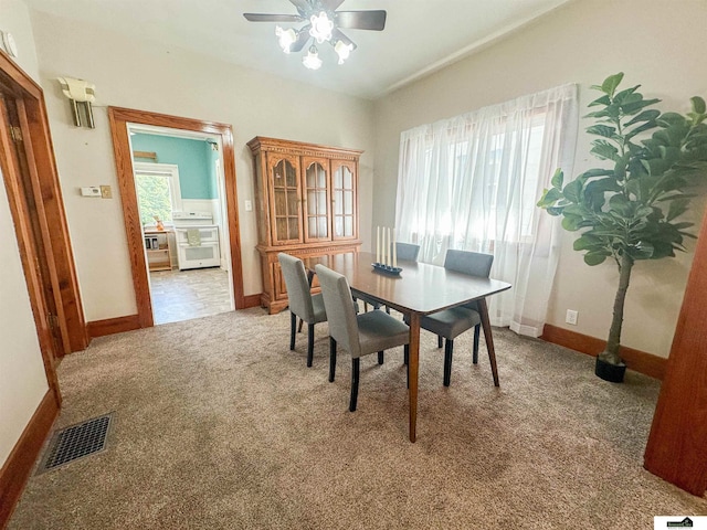 624 A St, Lincoln, NE 68502 - dining area featuring carpet flooring and a ceiling fan