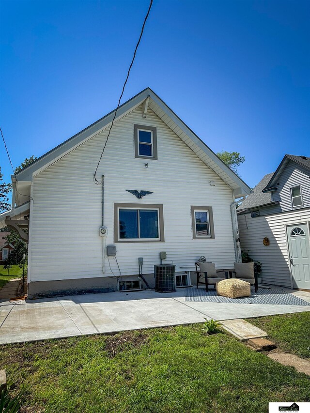 624 A St, Lincoln, NE 68502 - rear view of house featuring a patio