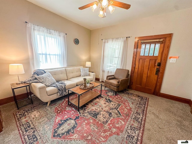 624 A St, Lincoln, NE 68502 - carpeted living area with ceiling fan and baseboards