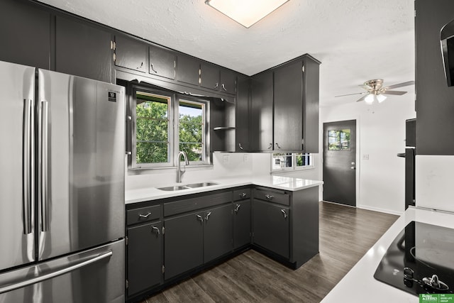 2330 S 90th St, Omaha, NE 68124 - kitchen with freestanding refrigerator, black electric cooktop, ceiling fan, light countertops, and dark wood-style floors