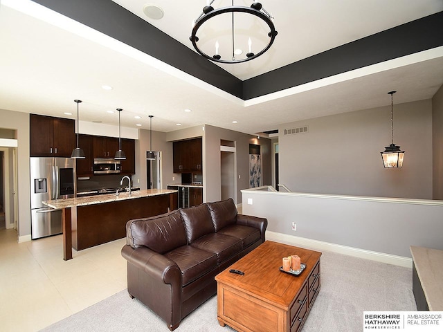 6535 N 157th St, Omaha, NE 68116 - living room featuring a chandelier and recessed lighting