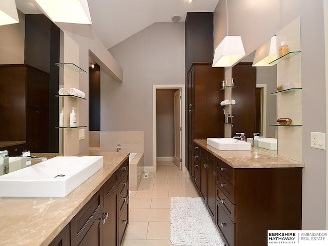 6535 N 157th St, Omaha, NE 68116 - full bathroom featuring two vanities, a bath, tile patterned flooring, and high vaulted ceiling