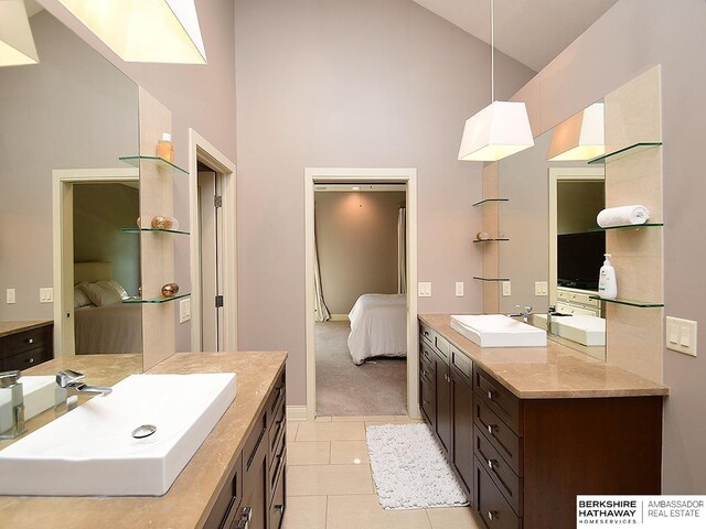 6535 N 157th St, Omaha, NE 68116 - ensuite bathroom with high vaulted ceiling, vanity, and tile patterned floors