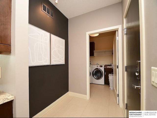 6535 N 157th St, Omaha, NE 68116 - laundry room featuring separate washer and dryer and light tile patterned floors