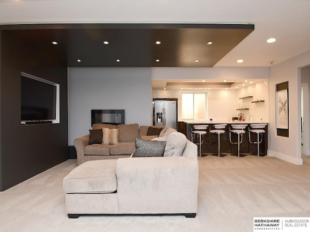 6535 N 157th St, Omaha, NE 68116 - living room featuring light carpet, recessed lighting, and wet bar