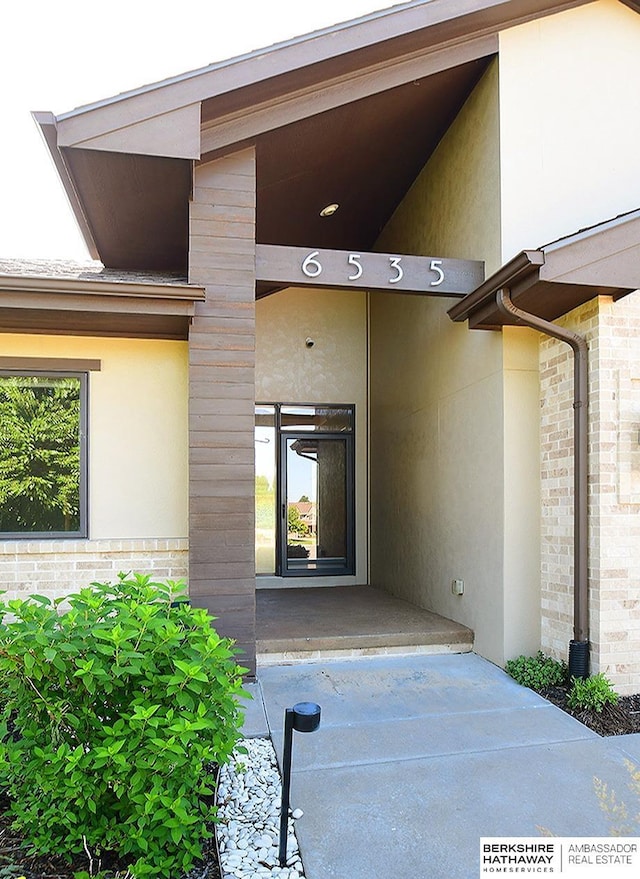 6535 N 157th St, Omaha, NE 68116 - entrance to property with stucco siding and brick siding