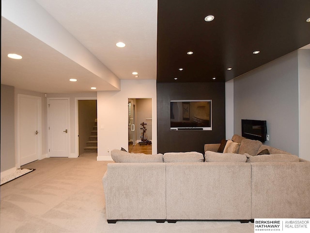 6535 N 157th St, Omaha, NE 68116 - living area featuring recessed lighting, light carpet, and stairs