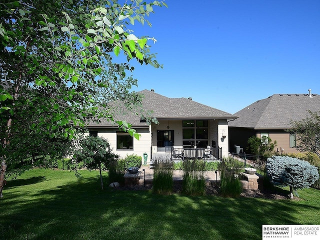 6535 N 157th St, Omaha, NE 68116 - back of property with a yard and a porch