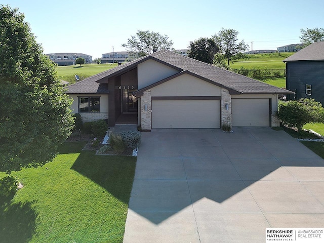6535 N 157th St, Omaha, NE 68116 - view of front facade with an attached garage, a front lawn, concrete driveway, a shingled roof, and stucco siding