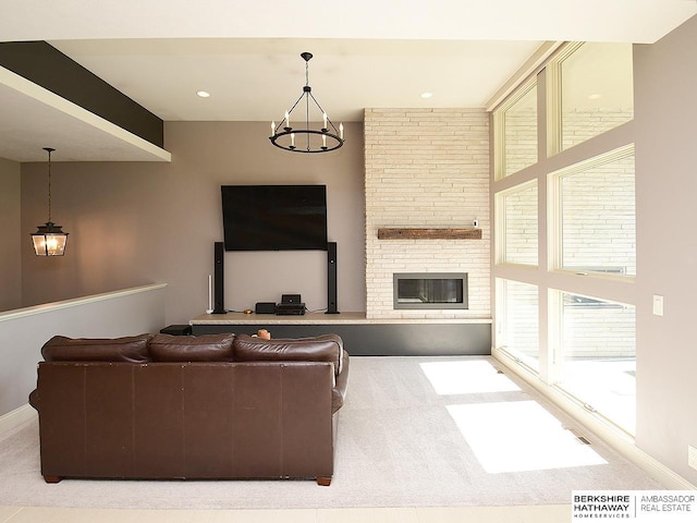 6535 N 157th St, Omaha, NE 68116 - carpeted living room featuring a large fireplace and a chandelier