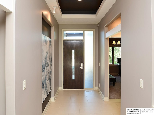 6535 N 157th St, Omaha, NE 68116 - entrance foyer with a raised ceiling and tile patterned flooring