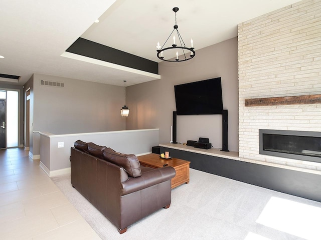 6535 N 157th St, Omaha, NE 68116 - living area featuring a chandelier and a brick fireplace