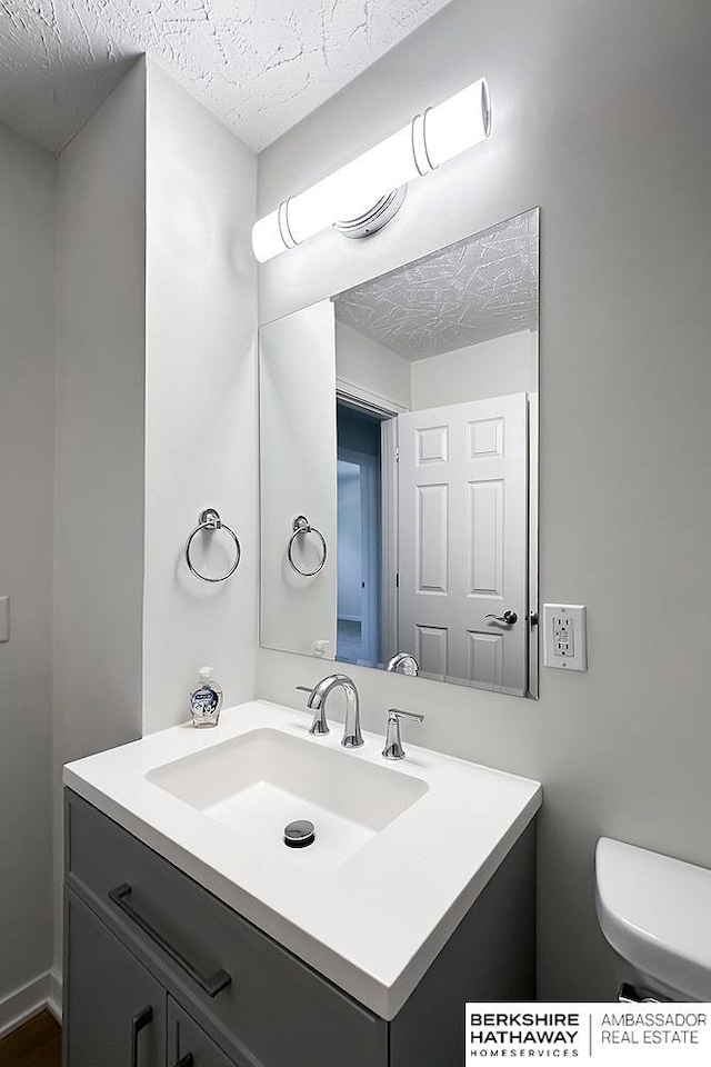 7025 S 41st St, Bellevue, NE 68147 - bathroom featuring vanity and a textured ceiling