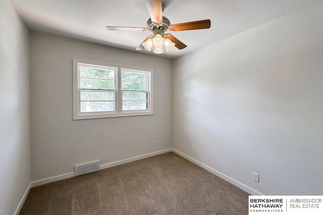 7025 S 41st St, Bellevue, NE 68147 - carpeted spare room with baseboards and a ceiling fan