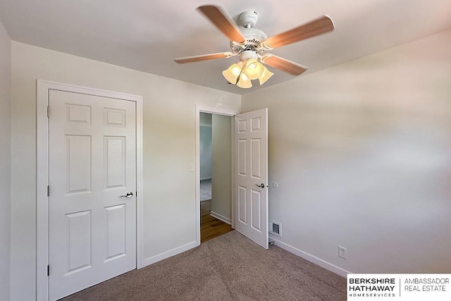 7025 S 41st St, Bellevue, NE 68147 - unfurnished bedroom with carpet floors and a ceiling fan