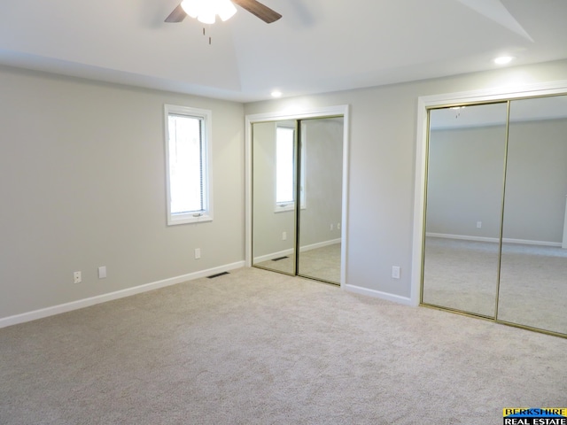 933 N 150th St, Omaha, NE 68154 - unfurnished bedroom featuring two closets, carpet flooring, recessed lighting, and ceiling fan