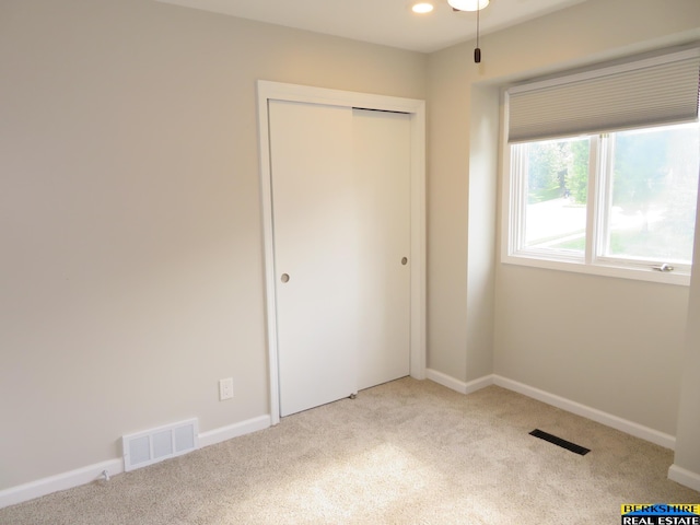 933 N 150th St, Omaha, NE 68154 - unfurnished bedroom featuring carpet and a closet