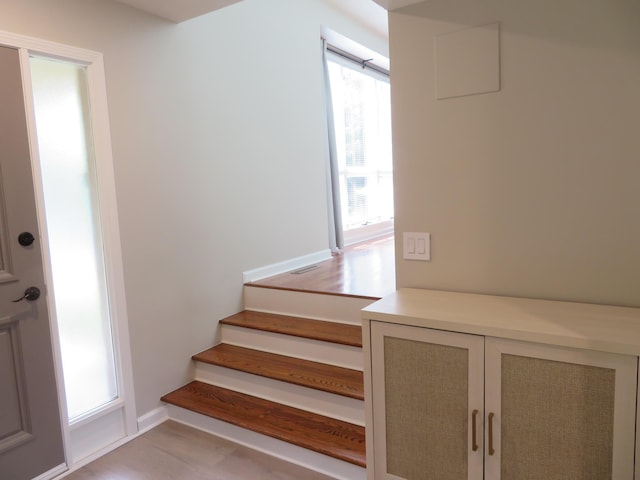 933 N 150th St, Omaha, NE 68154 - stairway featuring wood finished floors