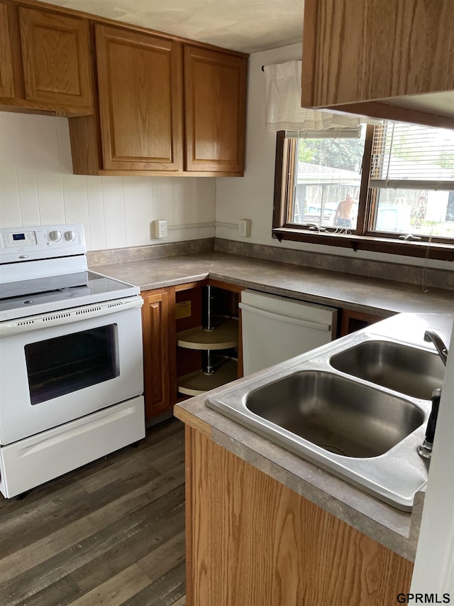 1327 N Cedar Ave, Hastings, NE 68901 - kitchen with white appliances, brown cabinetry, and dark wood-style floors